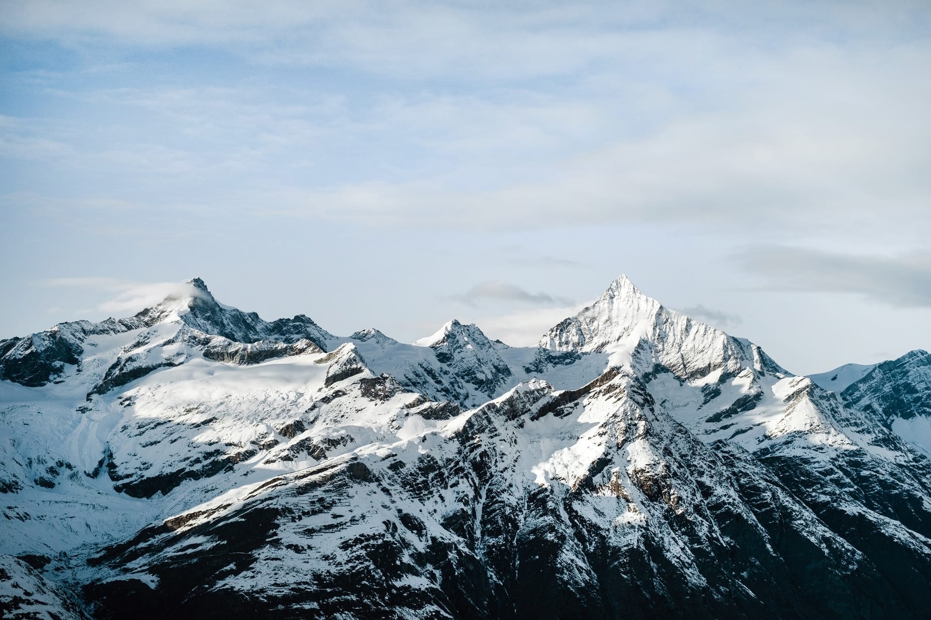Rocky mountain ridge with snow-covered tops disable-lazy-load